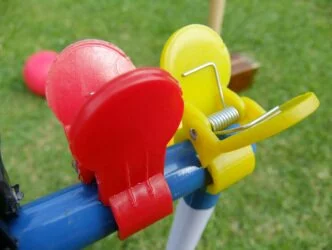 Red and Yellow croquet clips close up